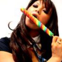 Amazingly brunette amateur British teen babe Natalia Blue sucking a long lollipop with lust